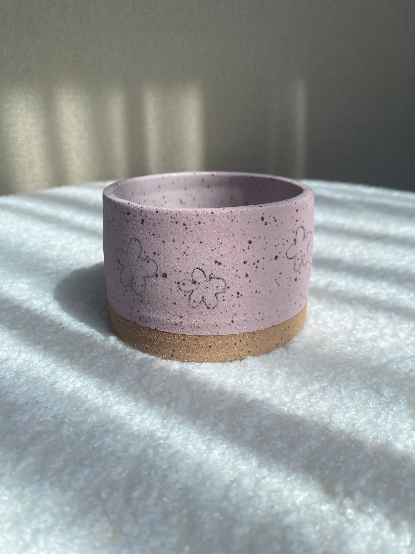 Pink planter with flower doodles