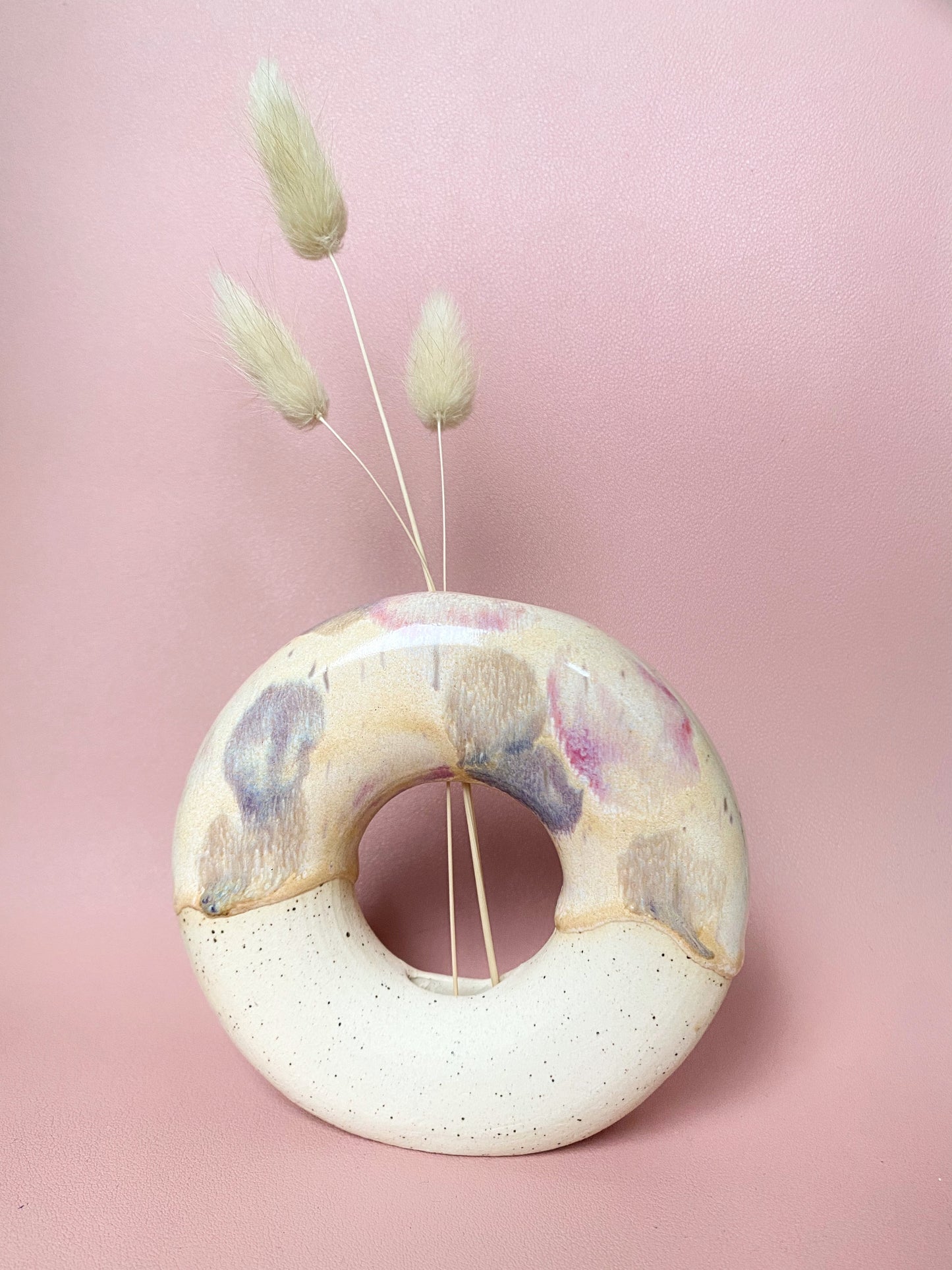 Multicoloured painted donut vase