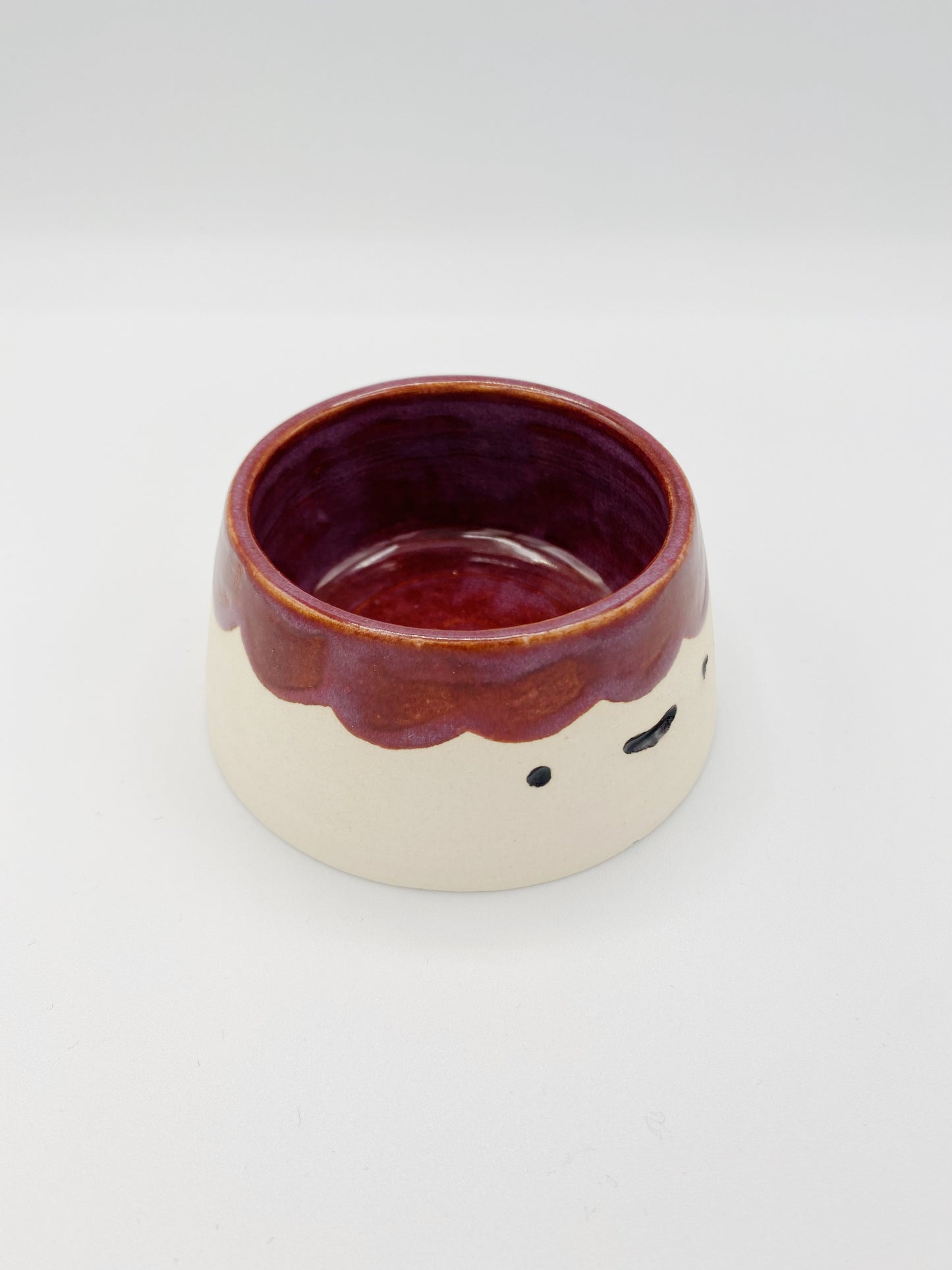 Happy maroon scalloped volcano