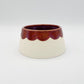 Happy maroon scalloped volcano